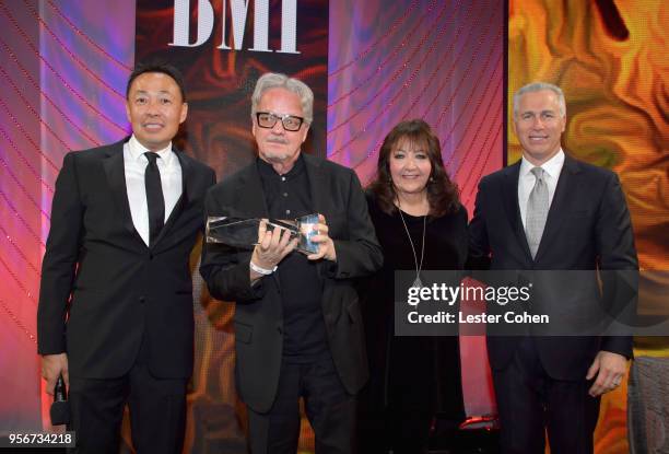 Mark Mothersbaugh accepts award from BMI Vice President, Creative - Film, TV & Visual Media Doreen Ringer Ross, Executive Vice President of Creative...