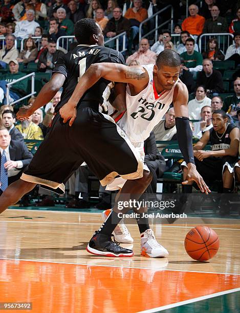 Cyrus McGowan of the Miami Hurricanes drives to the basket past Al-Farouq Aminu of the Wake Forest Demon Deacons on January 9, 2010 at the BankUnited...