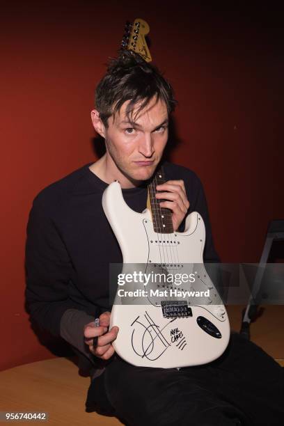 Guitarist Josh Klinghoffer of Red Hot Chili Peppers poses for a photo after rehearsal for the Musicares Concert for Recovery at the Showbox on May 9,...
