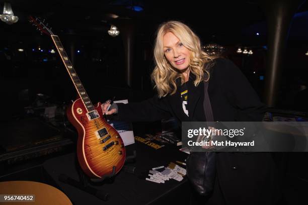 Musician Nancy Wilson of Heart signs an autograph after rehearsal for the Musicares Concert for Recovery at the Showbox on May 9, 2018 in Seattle,...