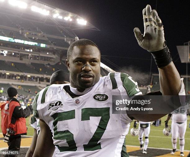 Linebacker Bart Scott of the New York Jets walks off the field after defeating the Cincinnati Bengals in the 2010 AFC wild-card playoff game at Paul...