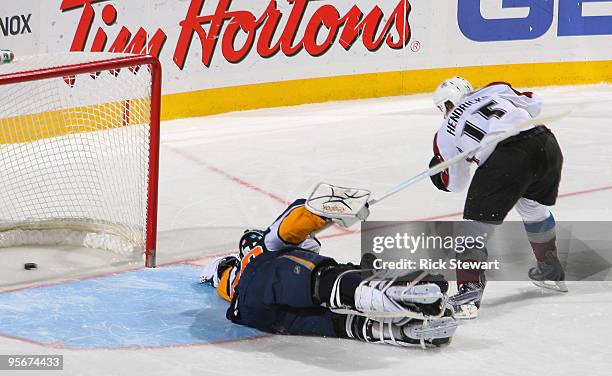 Matt Hendricks of the Colorado Avalanche scores the game winning goal in a shootout against Patrick Lalime of the Buffalo Sabres at HSBC Arena on...