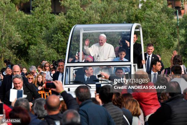 Pope Francis waves to the crowd during a pastoral visit to the catholic community founded by Don Zeno Saltini, on May 10, 2018 in Nomadelfia, near...