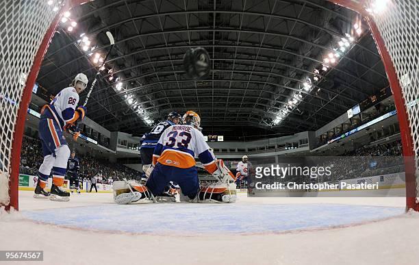 Scott Munroe of the Bridgeport Sound Tigers allows a goal during the first period against the Springfield Falcons on January 9, 2010 at the Arena at...