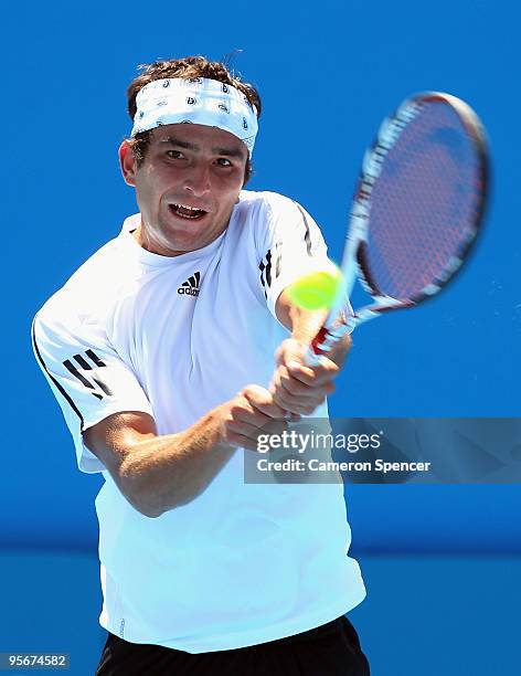 Marinko Matosevic of Australia plays a backhand in his first round match against Daniel Gimeno-Traver of Spain during day one of the 2010 Medibank...