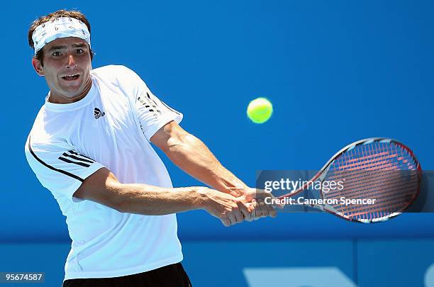 Marinko Matosevic of Australia plays a backhand in his first round match against Daniel Gimeno-Traver of Spain during day one of the 2010 Medibank...