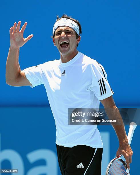 Marinko Matosevic of Australia plays shows his emotion in his first round match against Daniel Gimeno-Traver of Spain during day one of the 2010...