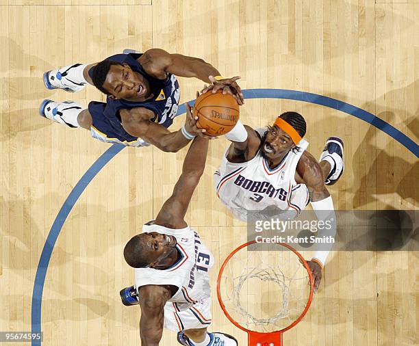 Gerald Wallace of the Charlotte Bobcats dunks against Hasheem Thabeet of the Memphis Grizzlies as Nazr Mohammed reaches in on January 9, 2010 at the...