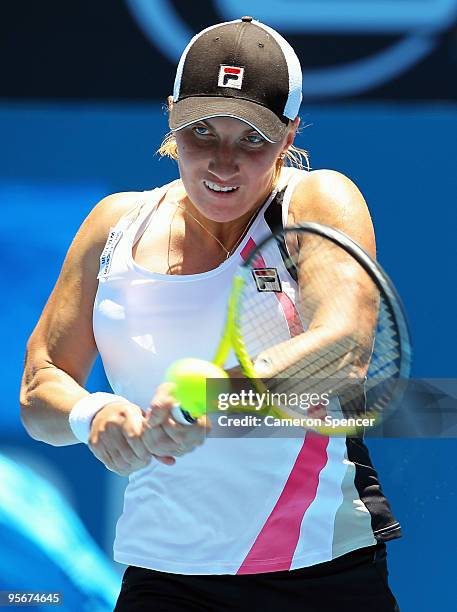 Svetlana Kuznetsova of Russia plays a backhand in her first round match against Alisa Kleybanova of Russia during day one of the 2010 Medibank...