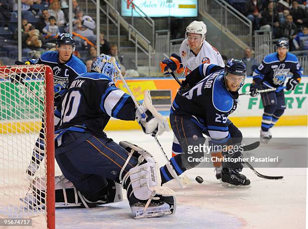 Devan Dubnyk of the Springfield Falcons makes a stick save during the third period against the Bridgeport Sound Tigers on January 9, 2010 at the...