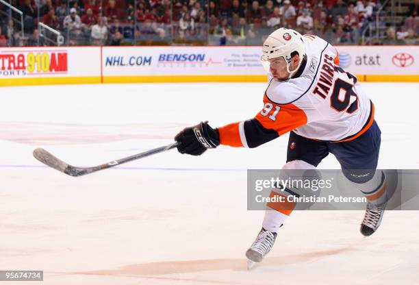 John Tavares of the New York Islanders shoots the puck during the NHL game against the Phoenix Coyotes at Jobing.com Arena on January 9, 2010 in...