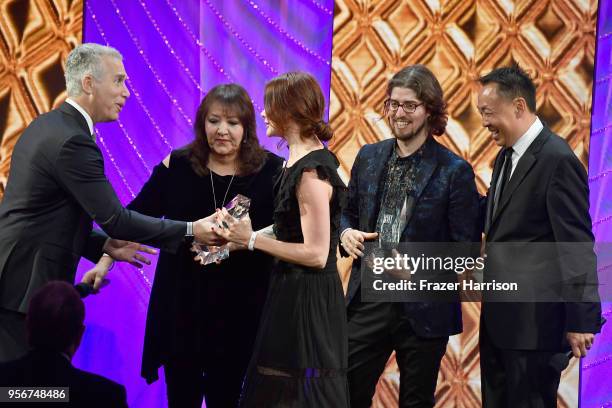 Suzanne Santo and Benjamin Jaffee accept award from BMI Vice President, Creative - Film, TV & Visual Media Doreen Ringer Ross, Executive Vice...