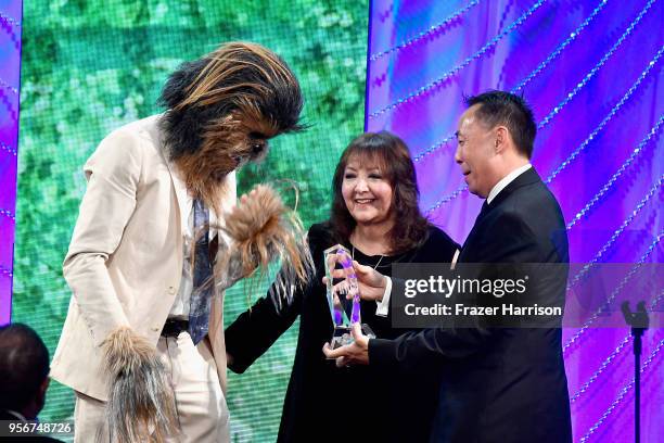 Chad Fischer accepts award from Doreen Ringer-Ross and BMI Assistant Vice President of Creative, Los Angeles Ray Yee onstage during 34th Annual BMI...