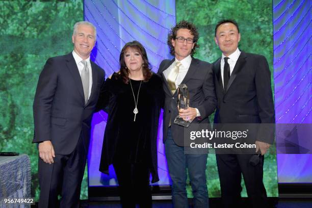 Ben Decter accepts award from BMI Vice President, Creative - Film, TV & Visual Media Doreen Ringer Ross, Executive Vice President of Creative &...