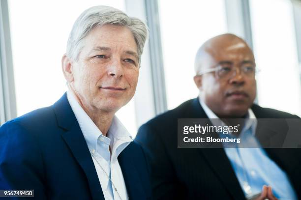 Steve Cornell, co-chief executive officer of Sasol Ltd., left, reacts as Bongani Nqwababa, co-chief executive officer of Sasol Ltd., looks on during...