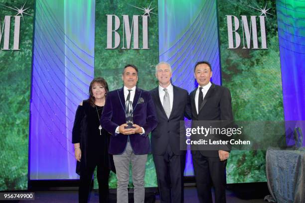 Nick Urata accepts award from BMI Vice President, Creative - Film, TV & Visual Media Doreen Ringer Ross, Executive Vice President of Creative &...