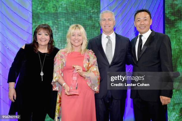 Gwendolyn Sanford accepts award from BMI Vice President, Creative - Film, TV & Visual Media Doreen Ringer Ross, Executive Vice President of Creative...