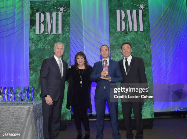 Andy Love accepts award from BMI Vice President, Creative - Film, TV & Visual Media Doreen Ringer Ross, Executive Vice President of Creative &...