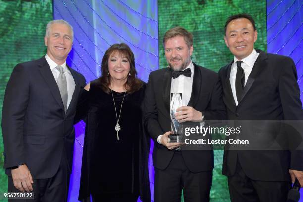 Atli Orvarsson accepts awards from BMI Vice President, Creative - Film, TV & Visual Media Doreen Ringer Ross, Executive Vice President of Creative &...