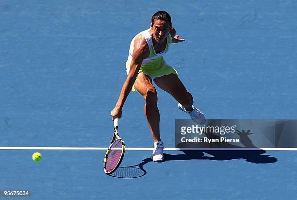 Francesca Schiavone of Italy plays a volley in her first round match against Elana Dementieva of Russia during day one of the 2010 Medibank...