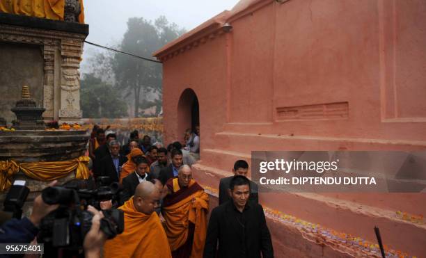 Tibetan spiritual leader The Dalai Lama makes his way to a special prayer session at The Mahabodhi Temple in Bodhgaya on January 10, 2010. Exiled...