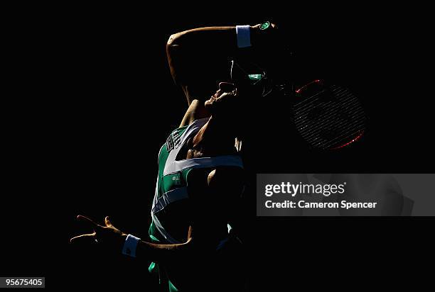 Elena Dementieva of Russia serves in her first round match against Francesca Schiavone of Italy during day one of the 2010 Medibank International at...