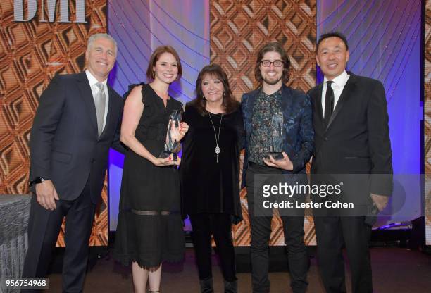 Suzanne Santo and Benjamin Jaffee accept award from BMI Vice President, Creative - Film, TV & Visual Media Doreen Ringer Ross, Executive Vice...