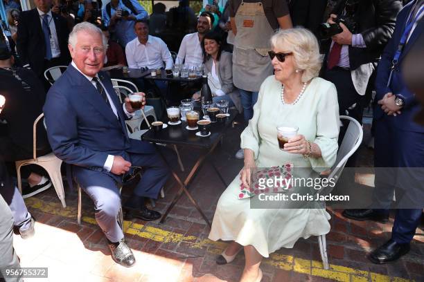 Prince Charles, Prince of Wales and Camilla, Duchess of Cornwall try traditional Greek coffee in a local café during a walking tour of the Kapnikarea...
