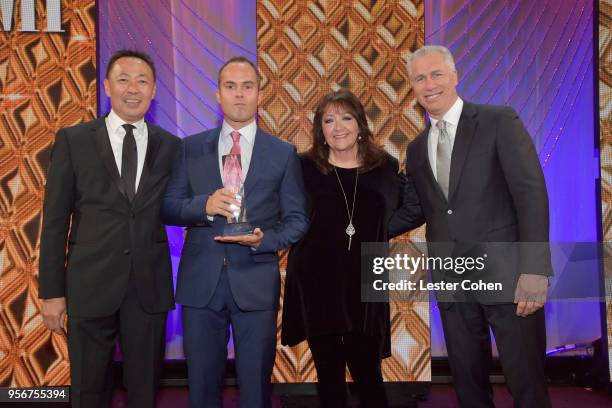 Andy Love accepts award from BMI Vice President, Creative - Film, TV & Visual Media Doreen Ringer Ross, Executive Vice President of Creative &...