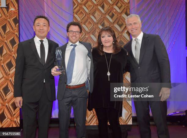 Jacob Shea accepts award from BMI Vice President, Creative - Film, TV & Visual Media Doreen Ringer Ross, Executive Vice President of Creative &...