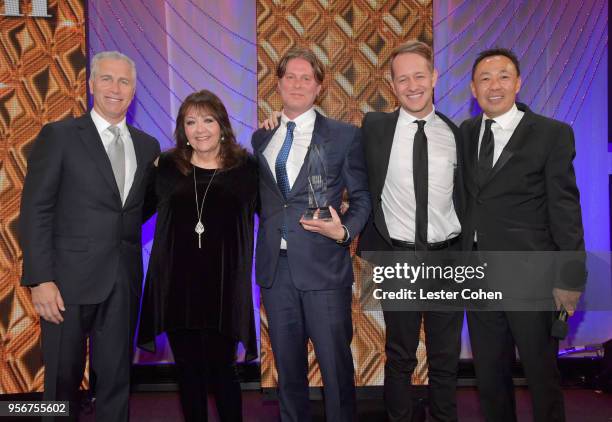 Michael Corcoran and Zack Hexum accept award from BMI Vice President, Creative - Film, TV & Visual Media Doreen Ringer Ross, Executive Vice President...