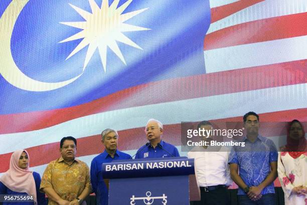 Najib Razak, Malaysia's outgoing prime minister, center, speaks during a news conference at the Barisan Nasional coalition headquarters in Kuala...