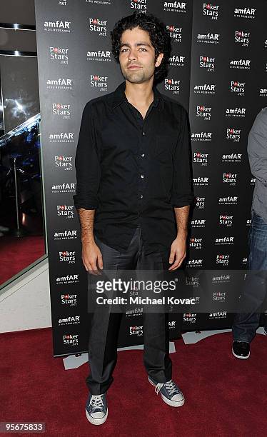 Actor Adrian Grenier arrives at the amfAR Cocktail Party & PokerStars Red Carpet And Party at Aura Nightclub on January 9, 2010 in Nassau, Bahamas.