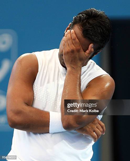 Leander Paes of India playing with Lucas Dlouhy of the Czech Republic reacts after losing a point in the men's doubles final against Marcus Gicquel...