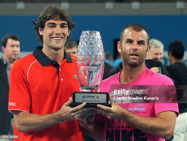 Jeremy Chardy of France and Marcus Gicquel of France pose with their trophy after defeating Lucas Dlouhy of the Czech Republic and Leander Paes of...