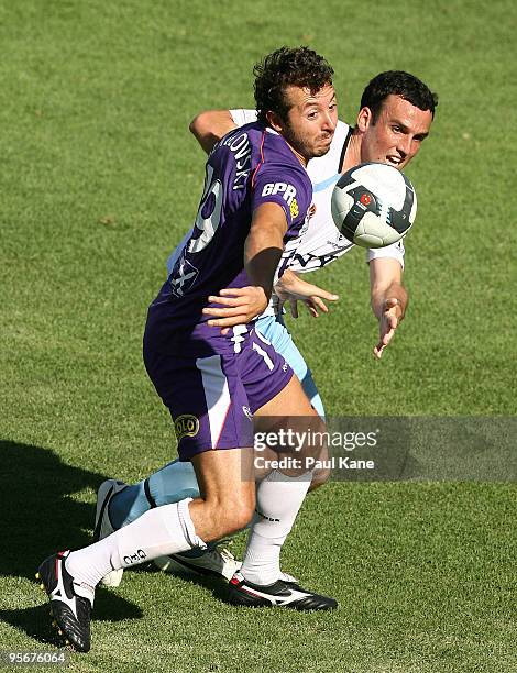 Naum Sekulovski of the Glory and Mark Bridge of Sydney vie for the ball during the round 22 A-League match between Perth Glory and Sydney FC at ME...