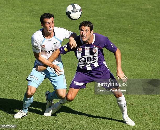 Mark Bridge of Sydney and Chris Coyne of the Glory contest the ball during the round 22 A-League match between Perth Glory and Sydney FC at ME Bank...