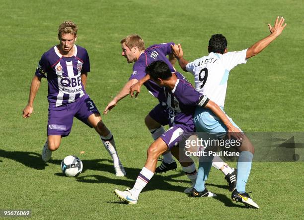 Andy Todd of the Glory breaks past John Aloisi of Sydney during the round 22 A-League match between Perth Glory and Sydney FC at ME Bank Stadium on...