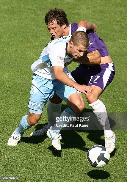 Shannon Cole of Sydney and Todd Howarth of the Glory battle for the ball during the round 22 A-League match between Perth Glory and Sydney FC at ME...