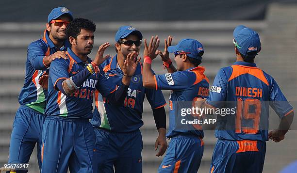 Sri Lankan cricketer Thissara Perera leaves the ground after losing his wicket during the Tri-Nation tournament One Day International cricket match...