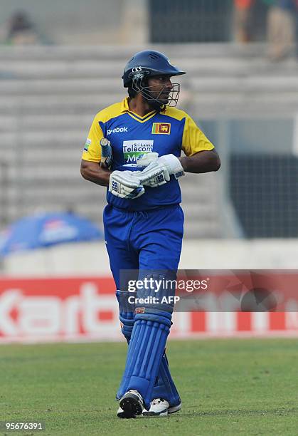 Sri Lankan cricket captain Kumar Sangakkara leaves the ground after losing his wicket during the Tri-Nation tournament One Day International cricket...