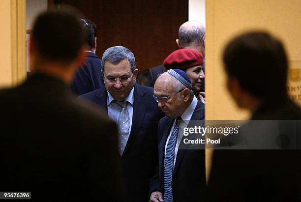 Israel's Defence Minister Ehud Barak and Justice Minister Yaacov Neeman arrive for the weekly cabinet meeting at his office on January 10, 2010 in...