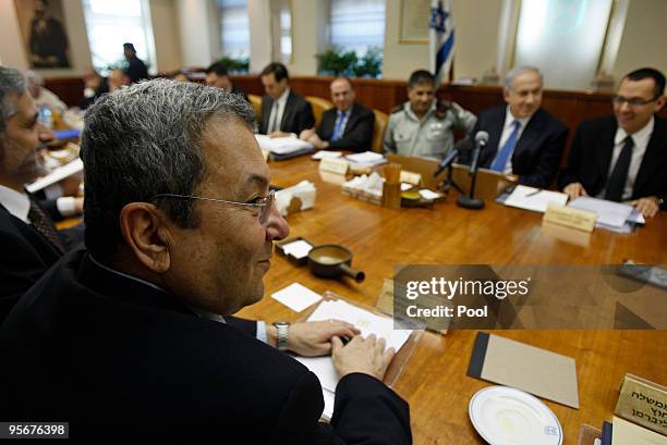 Israel's Defence Minister Ehud Barak sits across from Prime Minister Benjamin Netanyahu during the weekly cabinet at his office on January 10, 2010...