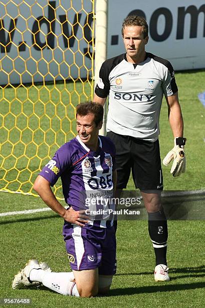 Jamie Harnwell of the Glory and gpalkeeper Clint Bolton of Sydney look on after a missed shot on goal during the round 22 A-League match between...
