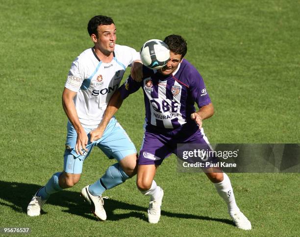 Mark Bridge of Sydney and Chris Coyne of the Glory contest the ball during the round 22 A-League match between Perth Glory and Sydney FC at ME Bank...