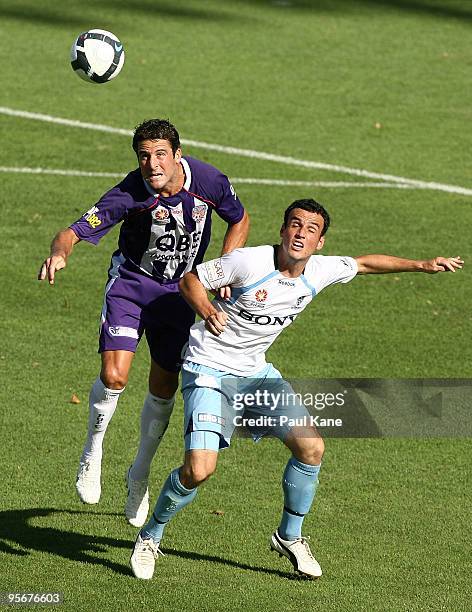 Chris Coyne of the Glory and Mark Bridge of Sydney contest the ball during the round 22 A-League match between Perth Glory and Sydney FC at ME Bank...