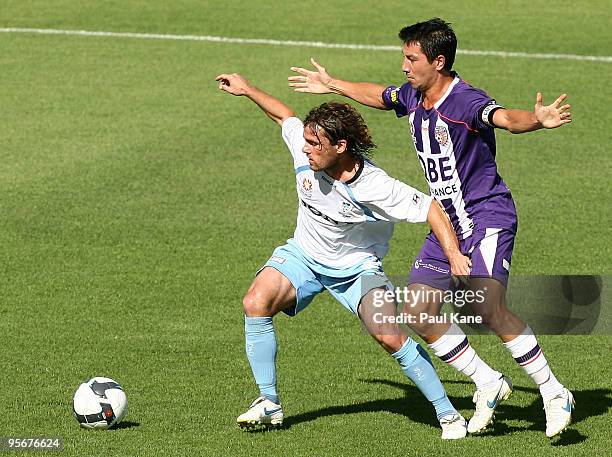 Karol Kisel of Sydney in action against Jacob Burns of the Glory during the round 22 A-League match between Perth Glory and Sydney FC at ME Bank...