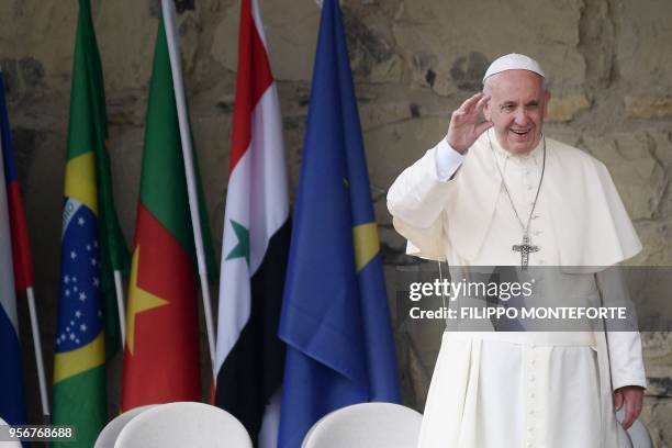 Pope Francis waves to the crowd as he arrives at the Mary Theotokos Shrine during a pastoral visit in Loppiano, on May 10, 2018 near Grosseto,...