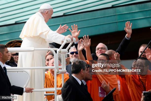 Pope Francis greets monks as he arrives at the Mary Theotokos Shrine during a pastoral visit in Loppiano, on May 10, 2018 near Grosseto, Tuscany.