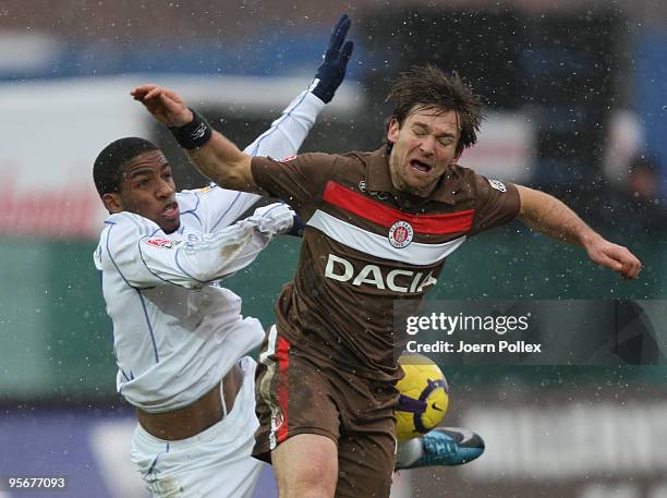 Marcel Eger of St. Pauli and Jefferson Farfan of Schalke battle for the ball during the friendly match between FC St. Pauli and FC Schalke 04 at the...